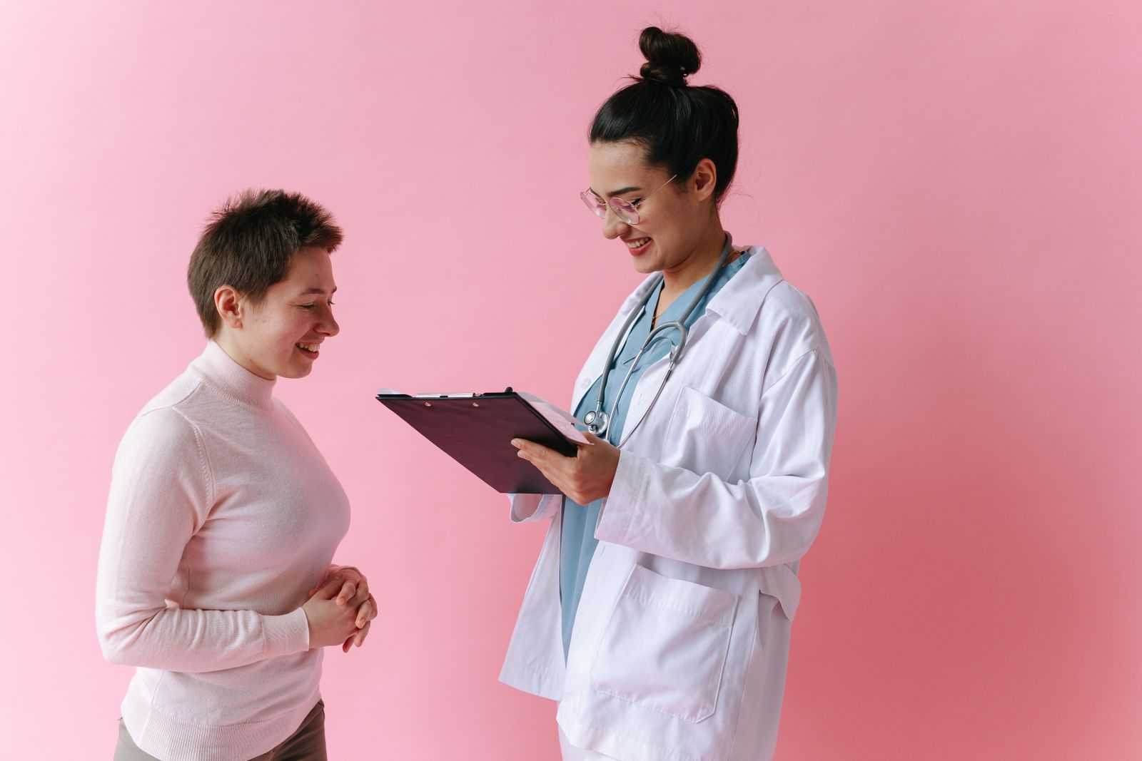 Doctor speaking with a patient in a bright clinic